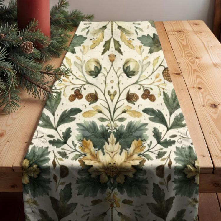 Green and gold botanical table runner on a rustic wooden table.