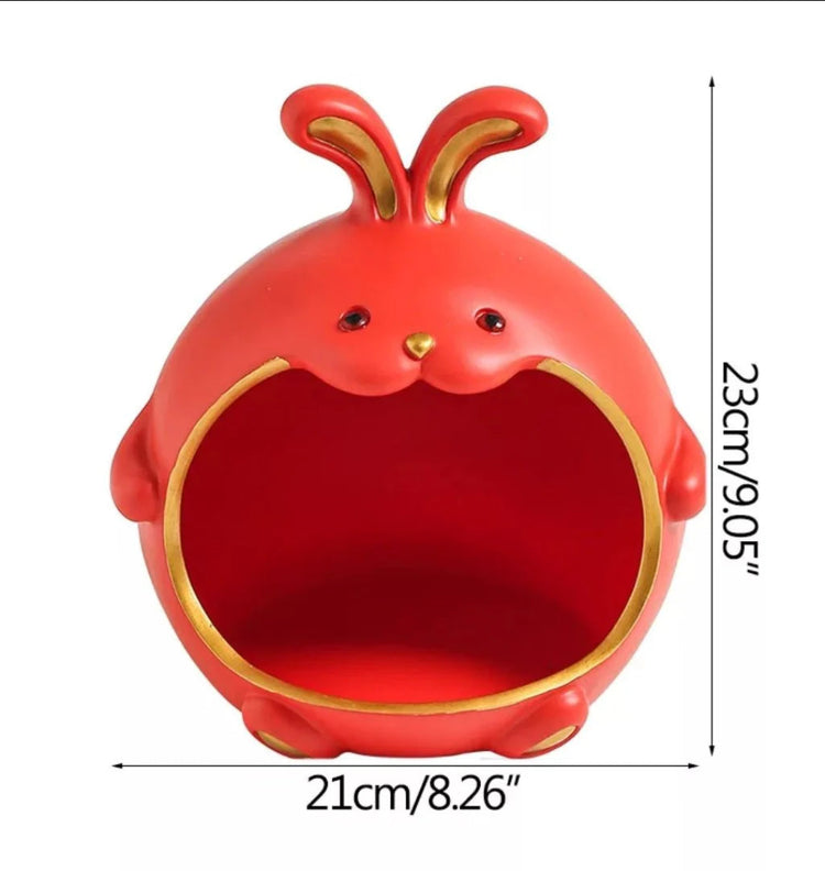 Red rabbit-shaped organizer with dimension markings.