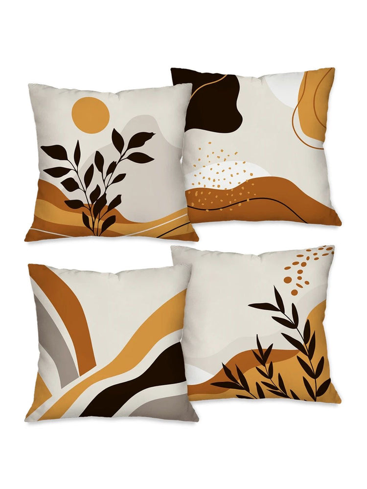Four cream cushion covers with mustard, brown and black abstract shapes and botanical details.