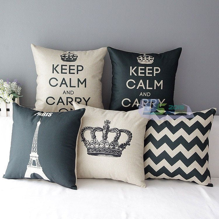 Five grey, blue and cream cushion covers with Keep Calm lettering, crown, Eiffel Tower and chevrons.