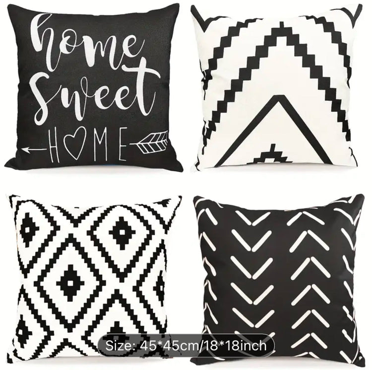 Four black and cream cushion covers with diamonds, chevrons and Home Sweet Home lettering.