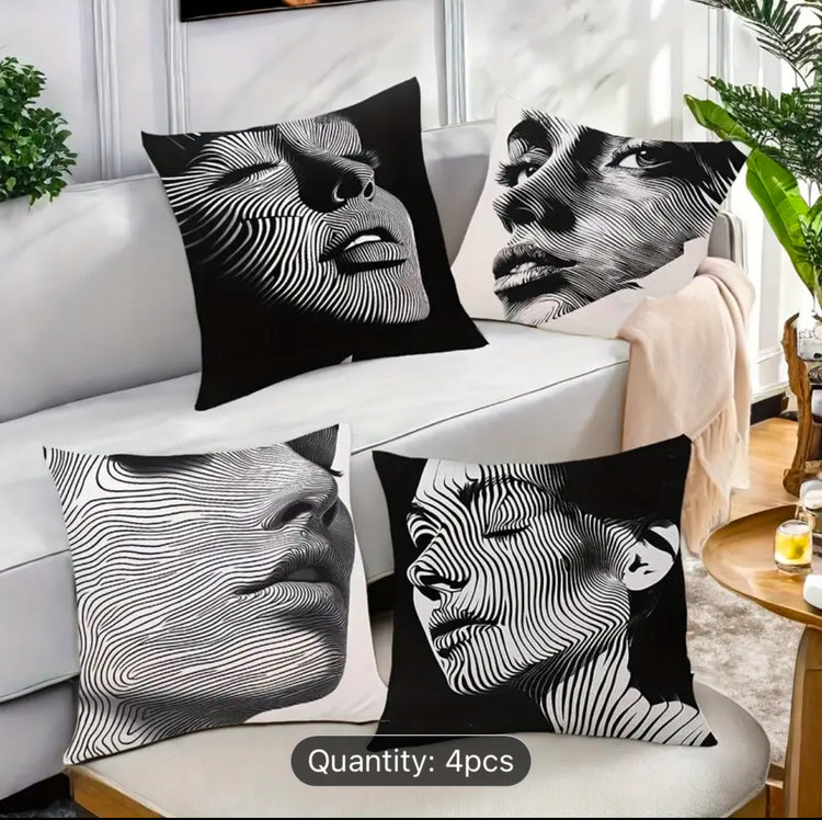 Four black and white cushion covers with close-up portraits and fine flowing line overlays.