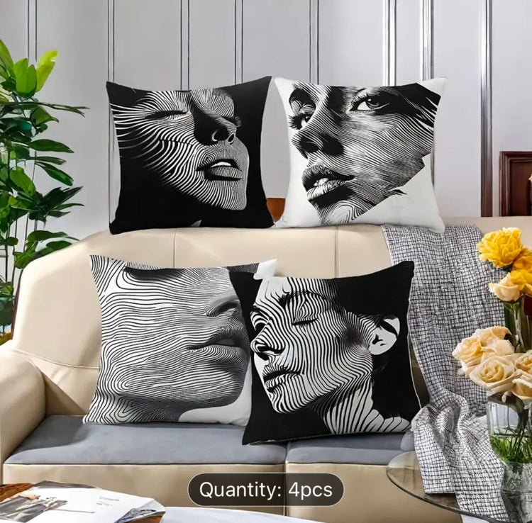 Four black and white cushion covers with close-up portraits and fine flowing line overlays.