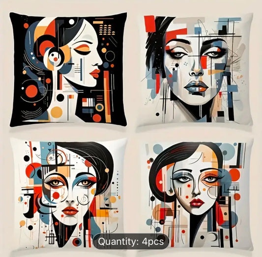 Four cream cushion covers with bold black, orange and blue abstract face illustrations.