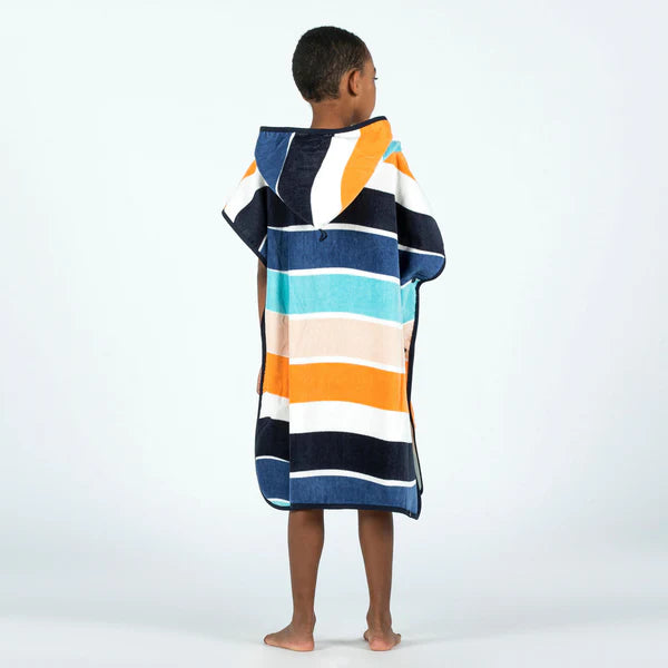Back view of a child wearing a multicoloured striped towel poncho.