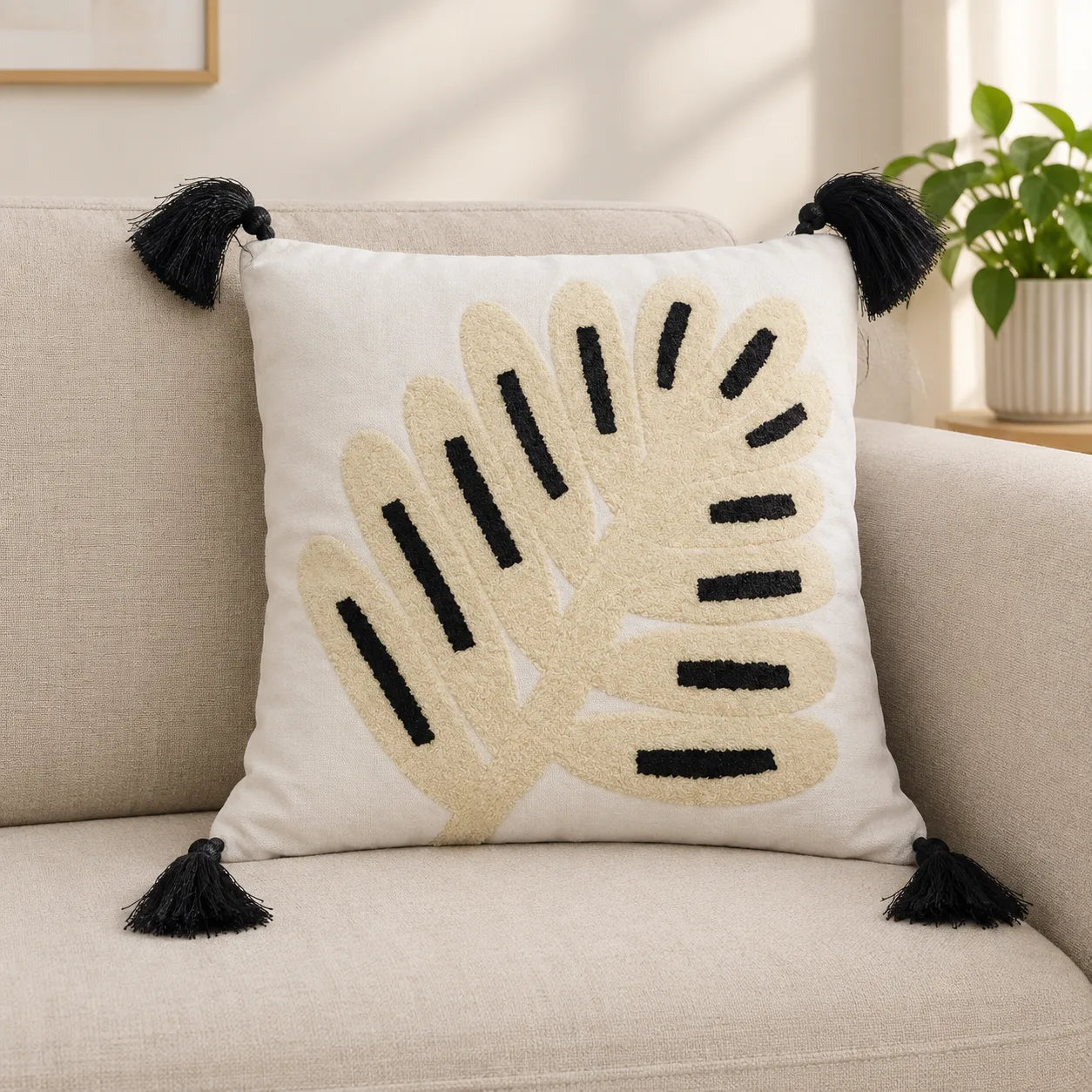 Minimal Leaf Embroidered Cushion Cover  placed on a sofa 