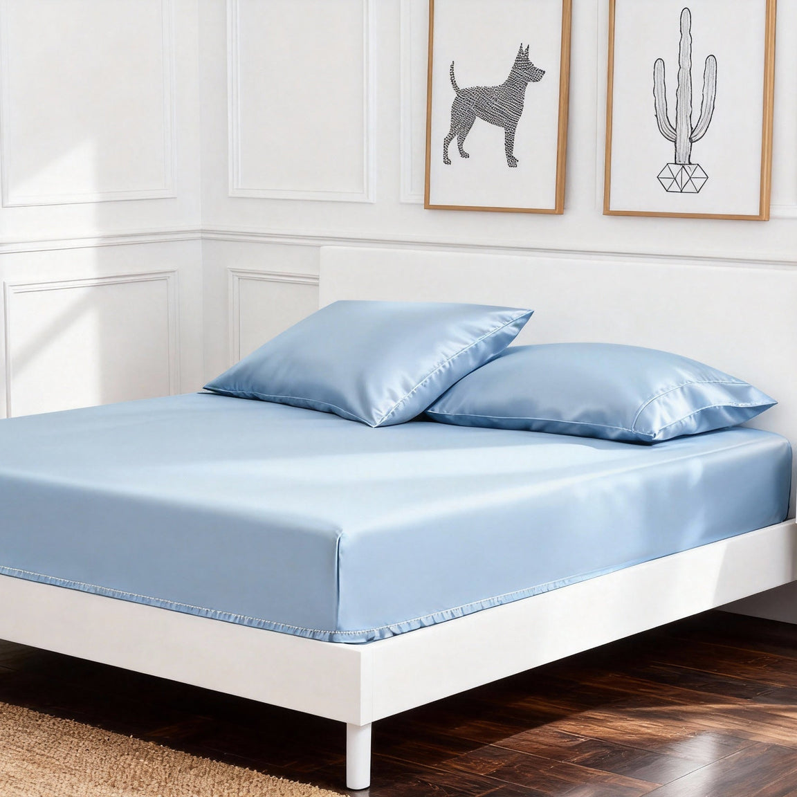Sky blue cotton fitted sheet displayed on a double bed with matching pillowcases.