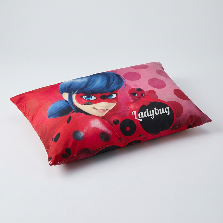 Angled view of the pink and red Ladybug character cushion cover.