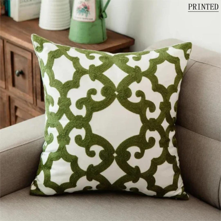 Olive green cushion cover with an ornate cream quatrefoil lattice pattern.