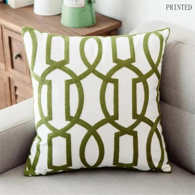 Cream cushion cover with tall linked olive green geometric loops.