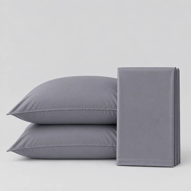 Two gray pillowcases stacked on the left and a folded matching gray pillowcase on the right, photographed on a clean light gray studio background.