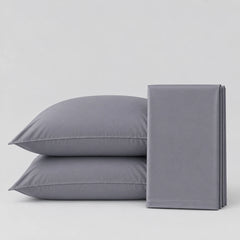 Two gray pillowcases stacked on the left and a folded matching gray pillowcase on the right, photographed on a clean light gray studio background.