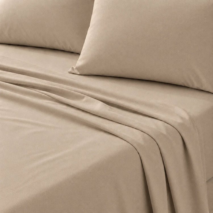Plain Cotton Satin Bedsheet Light Tan With Pillows close up shot
