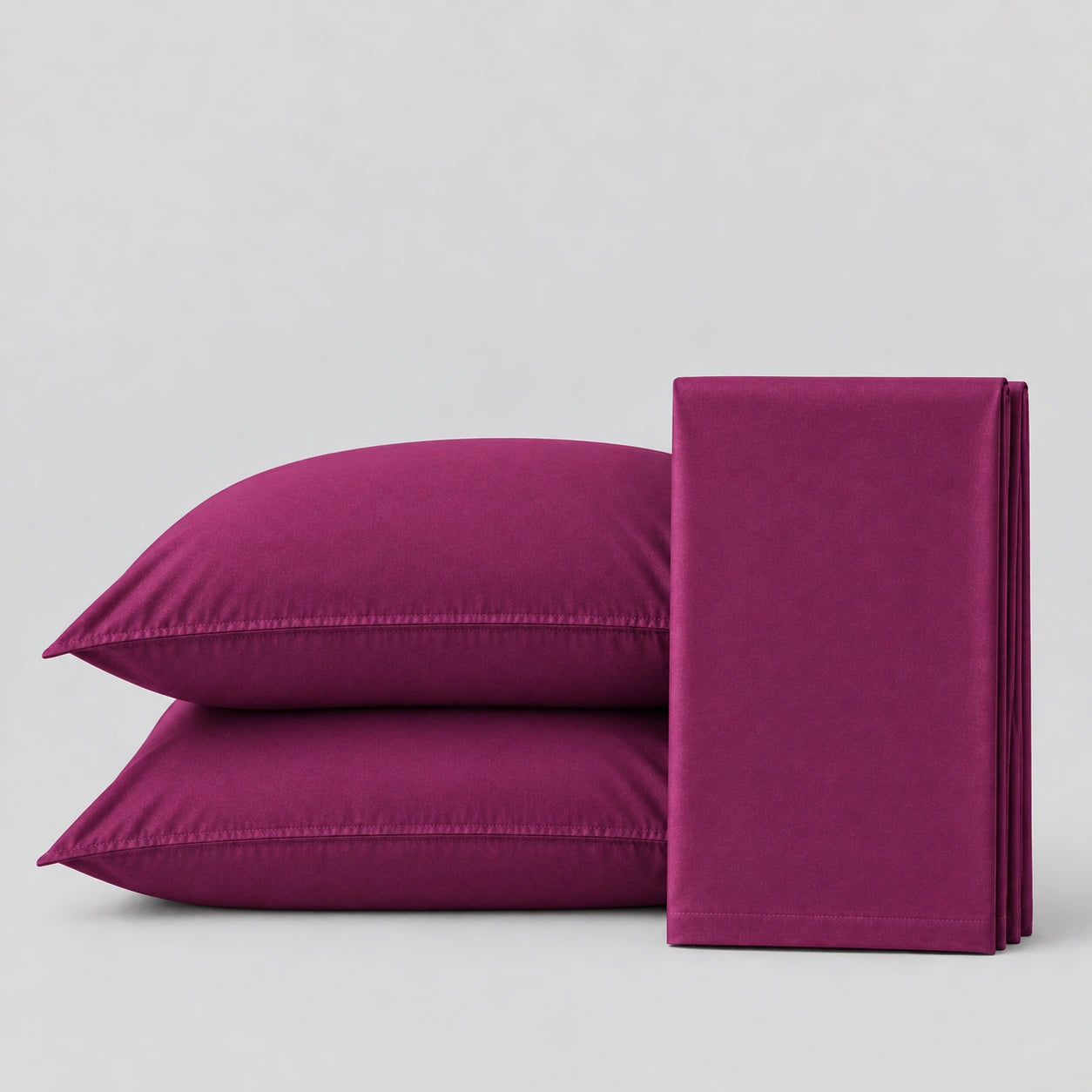 Plain Cotton Satin Bedsheet Set Meganta Plum  on light grey surface 
