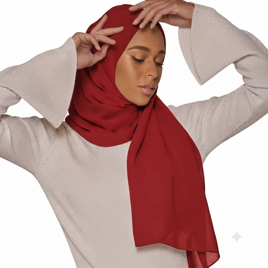 Model wearing a plain burgundy chiffon stole as a headscarf.
