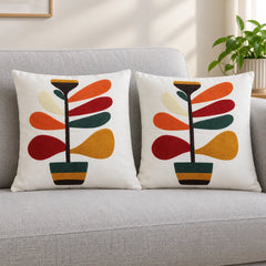 Retro Garden Embroidered Cushion Cover Pack of 2 placed on a sofa
