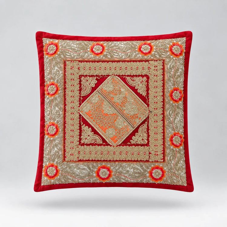 Red-bordered cushion cover with pale green ornamental bands and a large central diamond.