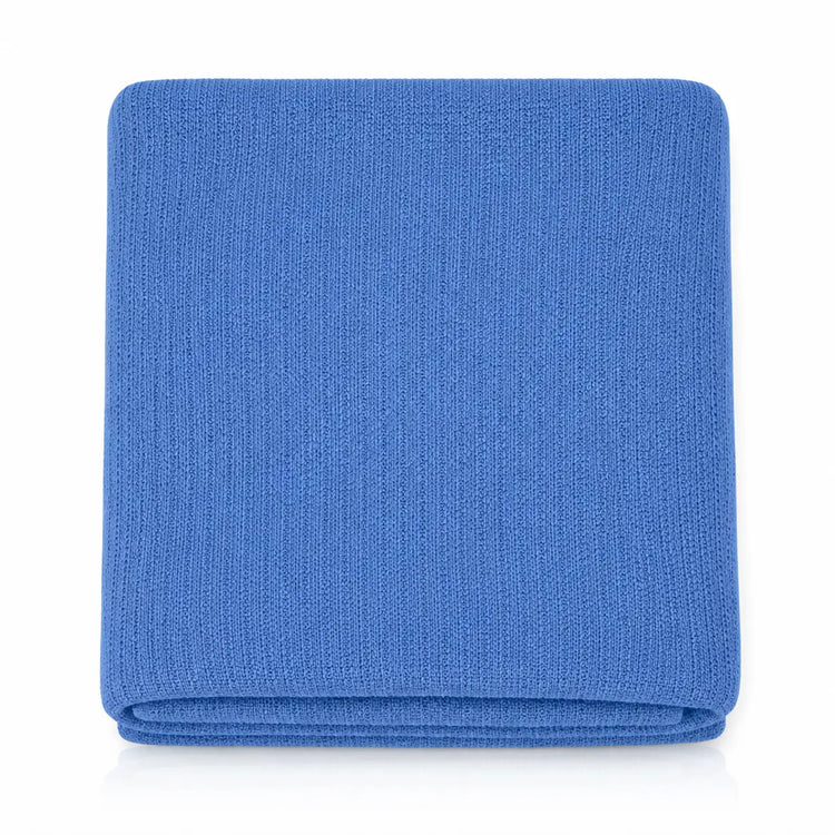 Folded blue ribbed blanket viewed from above.
