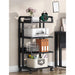 Four-tier rolling office rack holding a printer, folders and storage boxes beside a desk.