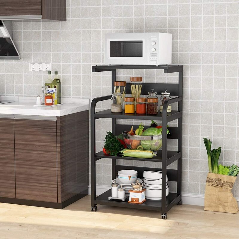 Black rolling kitchen rack holding a microwave, condiments and produce