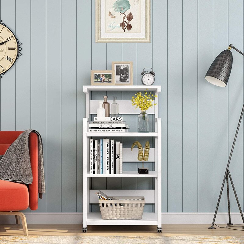White shelving cart displaying books, flowers and a basket beside an armchair