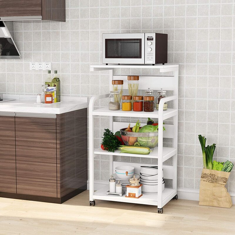 White rolling kitchen rack holding a microwave, condiments and produce
