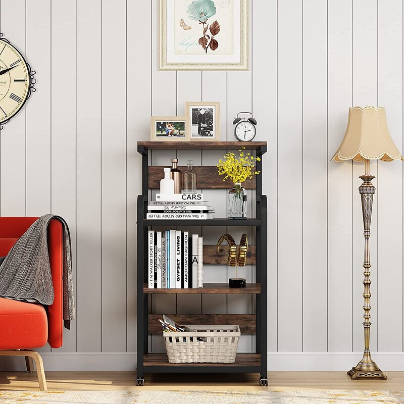 Brown shelving cart displaying books, flowers and a basket beside an armchair