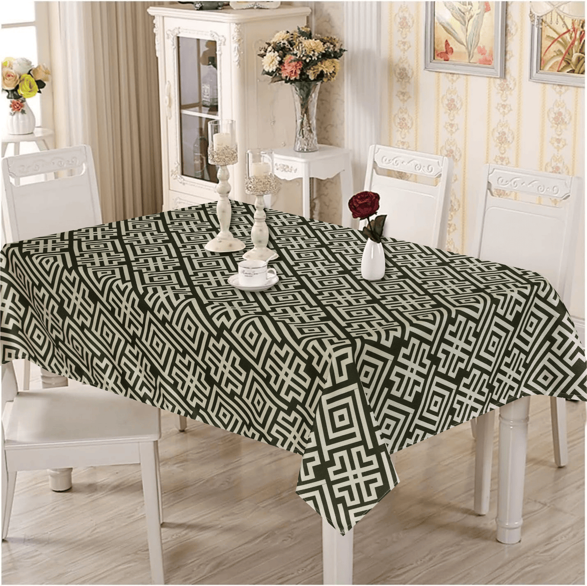 Cream and dark green geometric tablecloth on a dining table.