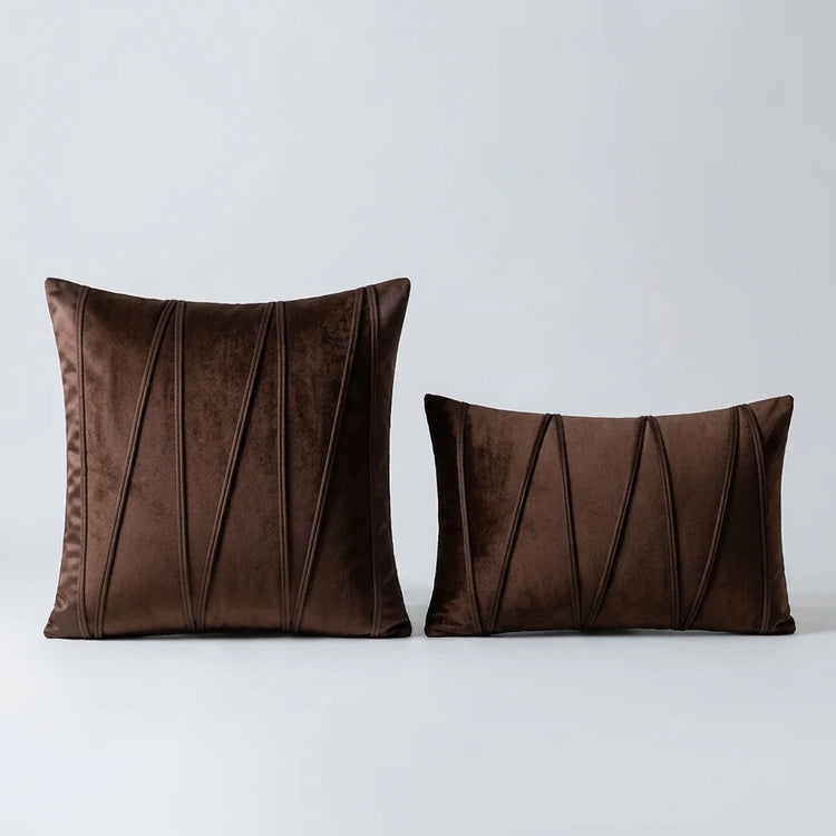 Velvet Prism Stripe Cushion Cover placed on a light grey surface 