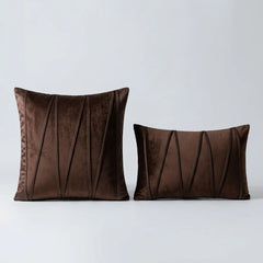 Velvet Prism Stripe Cushion Cover placed on a light grey surface 