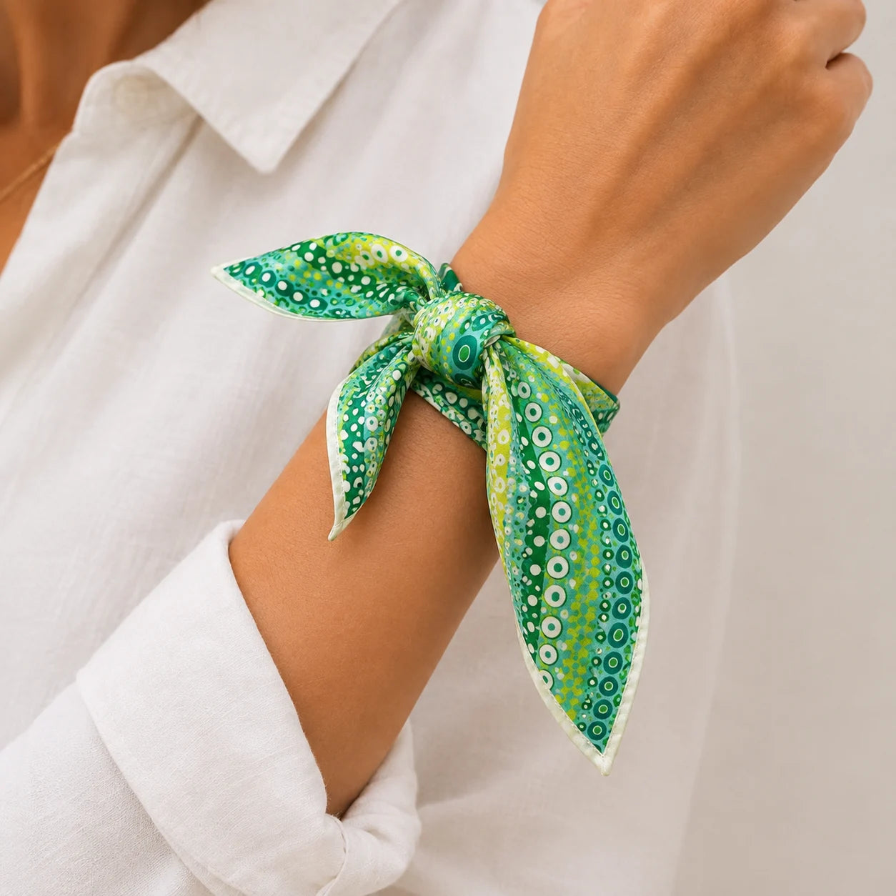 Veylora Bandana tied around a wrist in a close range shot 