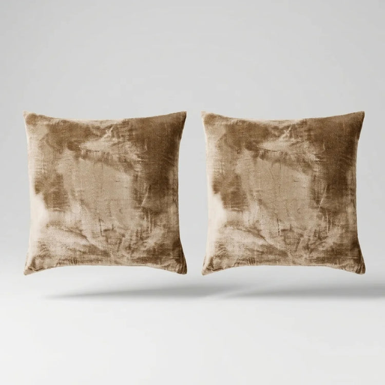 Vintage Velvet Cushion Covers floating on a light grey surface