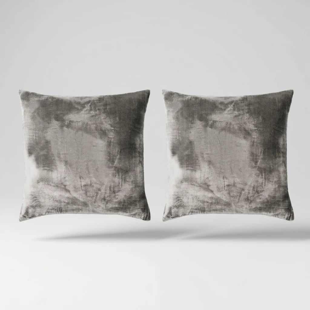 Vintage Velvet Cushion Covers floating on a light grey surface