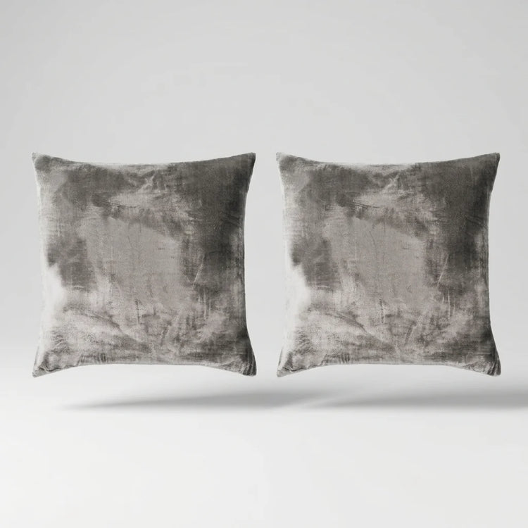 Vintage Velvet Cushion Covers floating on a light grey surface