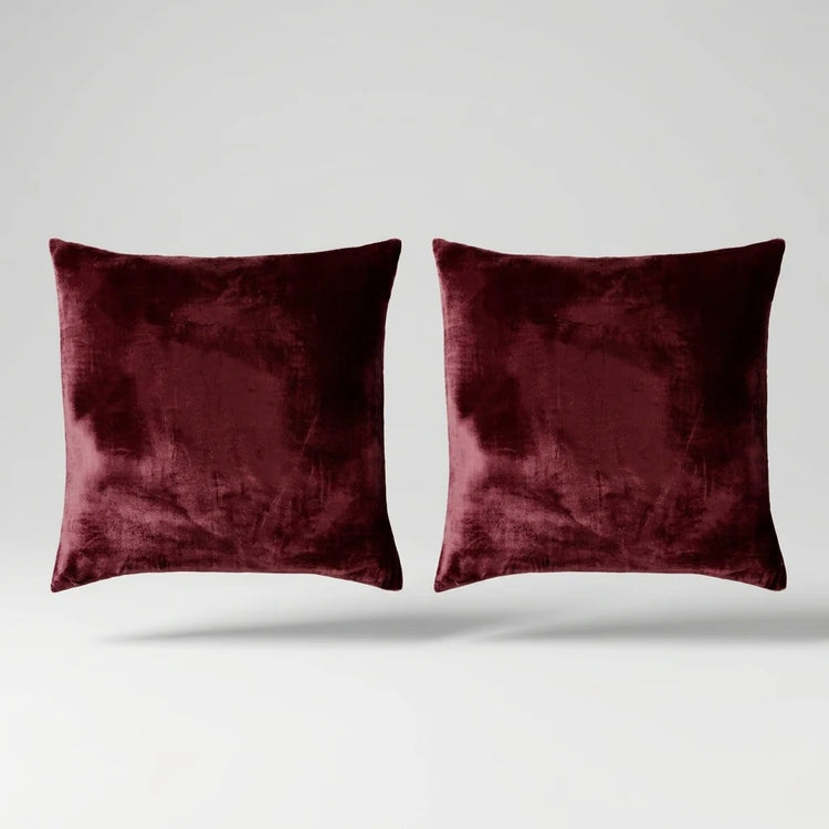 Vintage Velvet Cushion Covers floating on a light grey surface