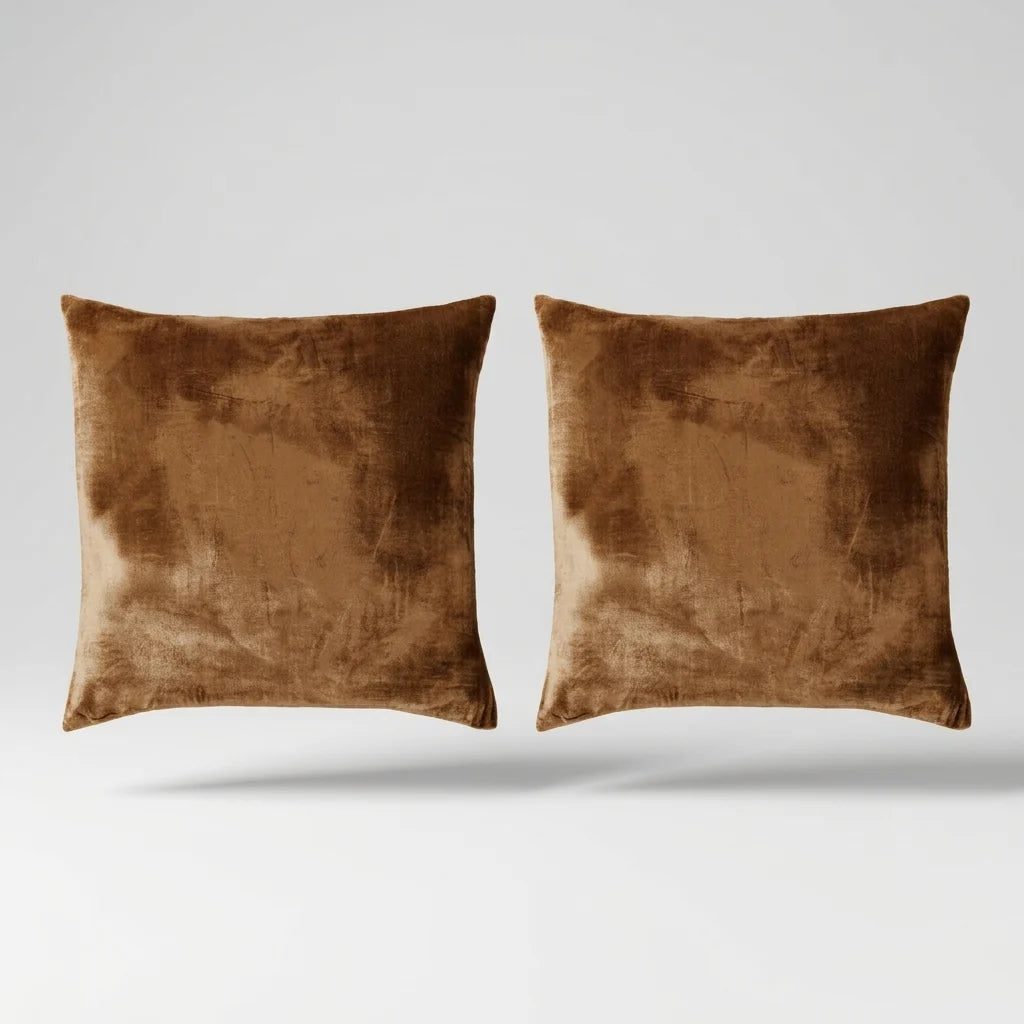 Vintage Velvet Cushion Covers floating on a light grey surface