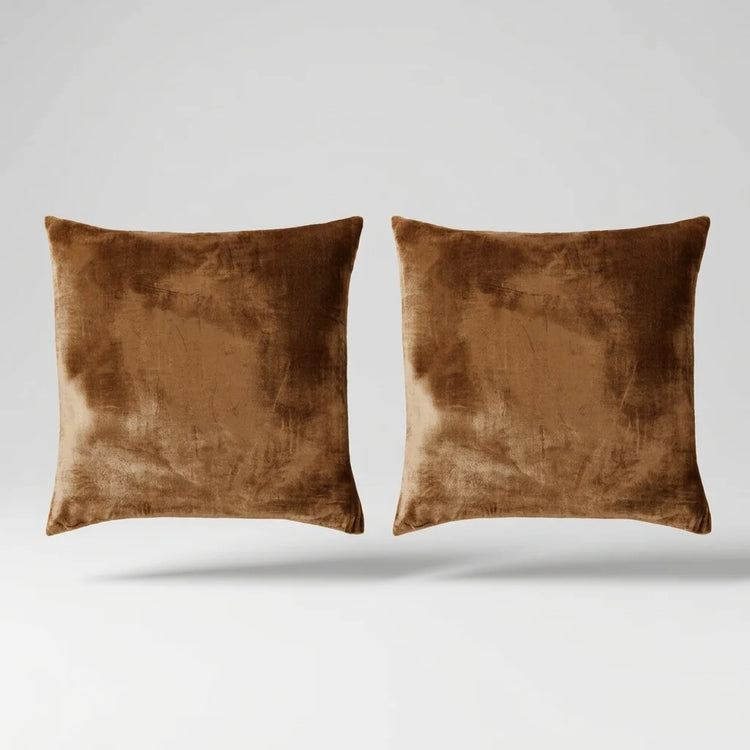 Vintage Velvet Cushion Covers floating on a light grey surface
