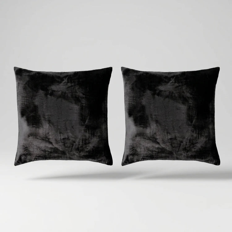 Vintage Velvet Cushion Covers floating on a light grey surface