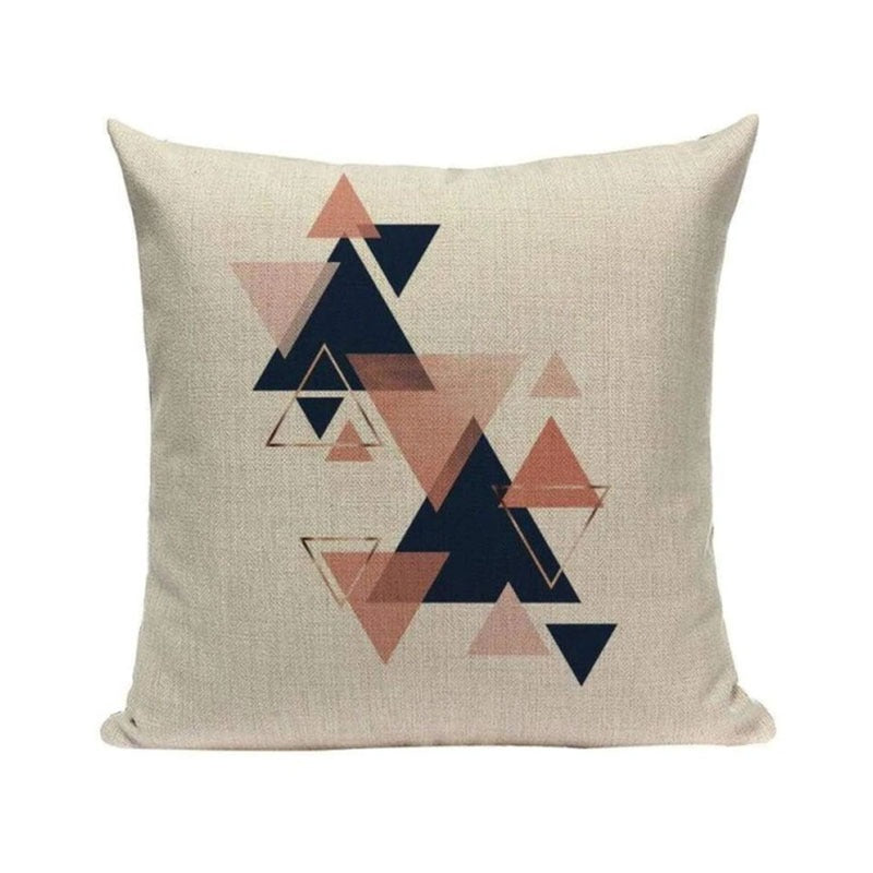 Cream cushion cover with navy, peach and grey triangles.