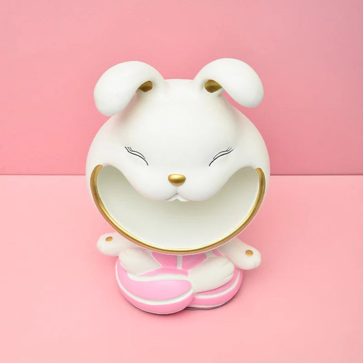 White rabbit-shaped decorative organizer with pink shoes.