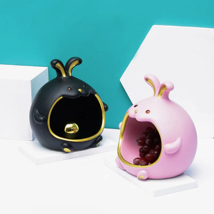 Black and pink rabbit-shaped organizers displayed together.