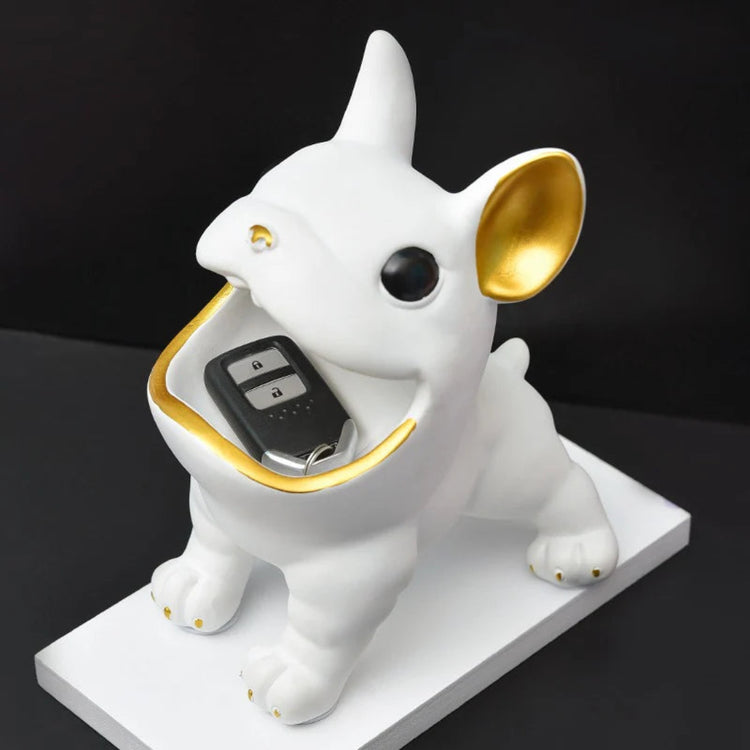 White bulldog-shaped organizer with a small item placed in its open mouth.