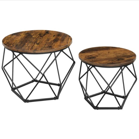 Empty pair of round brown nesting coffee tables with angular black wire bases.