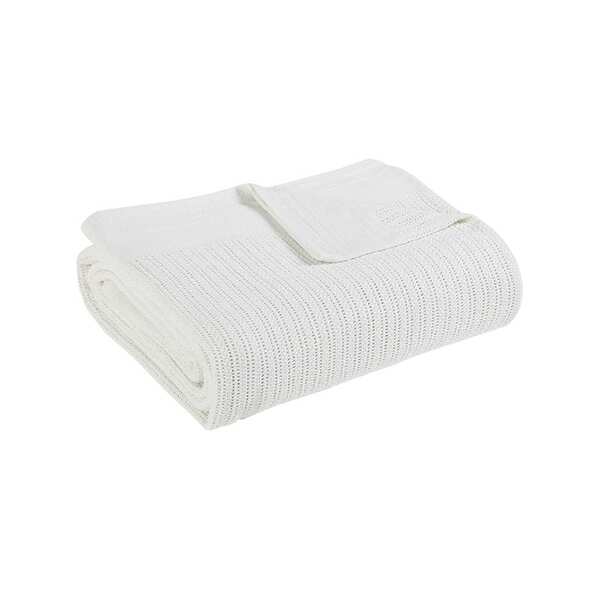 Folded white ribbed cotton thermal blanket.