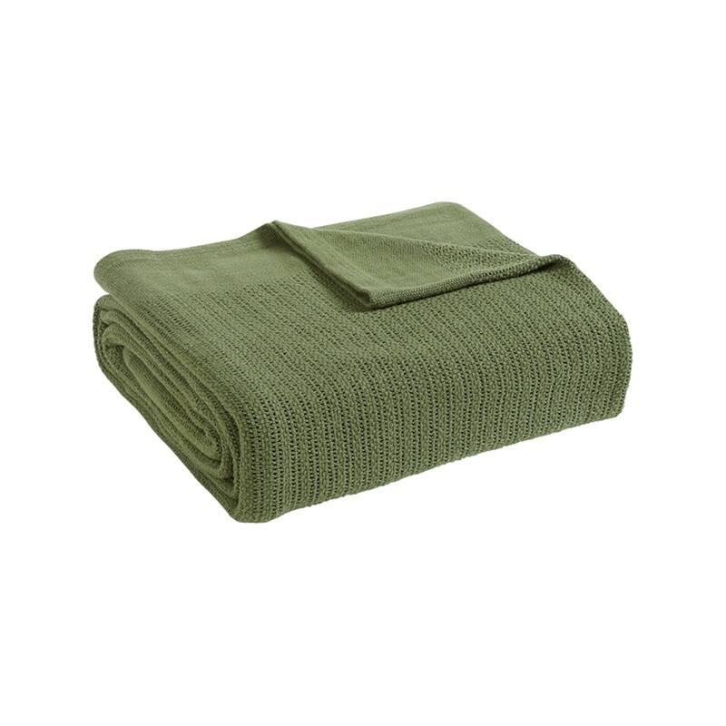 Folded olive green ribbed cotton thermal blanket.