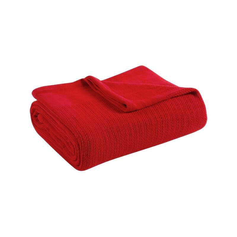 Folded red ribbed cotton thermal blanket.