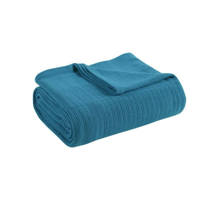 Folded teal ribbed cotton thermal blanket.
