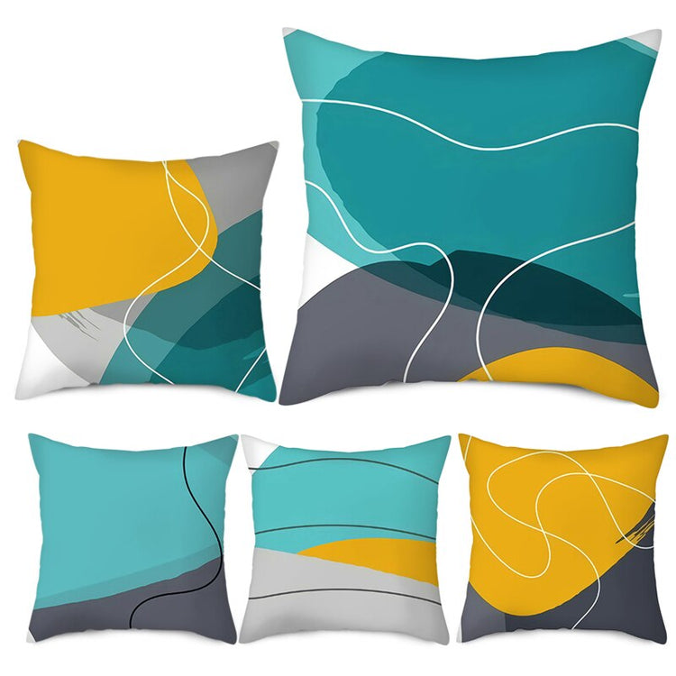 Cushion covers with teal, mustard and grey abstract colour blocks and fine curved lines.