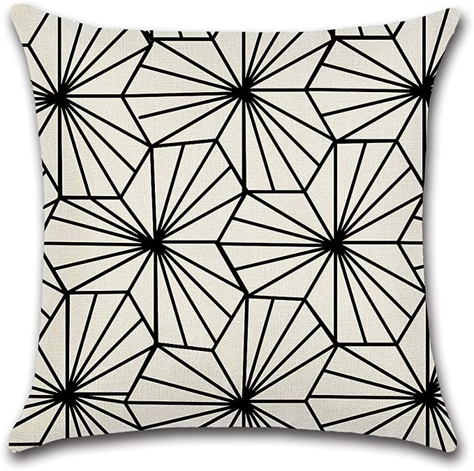 Cream cushion cover with fine black geometric starburst patterns.
