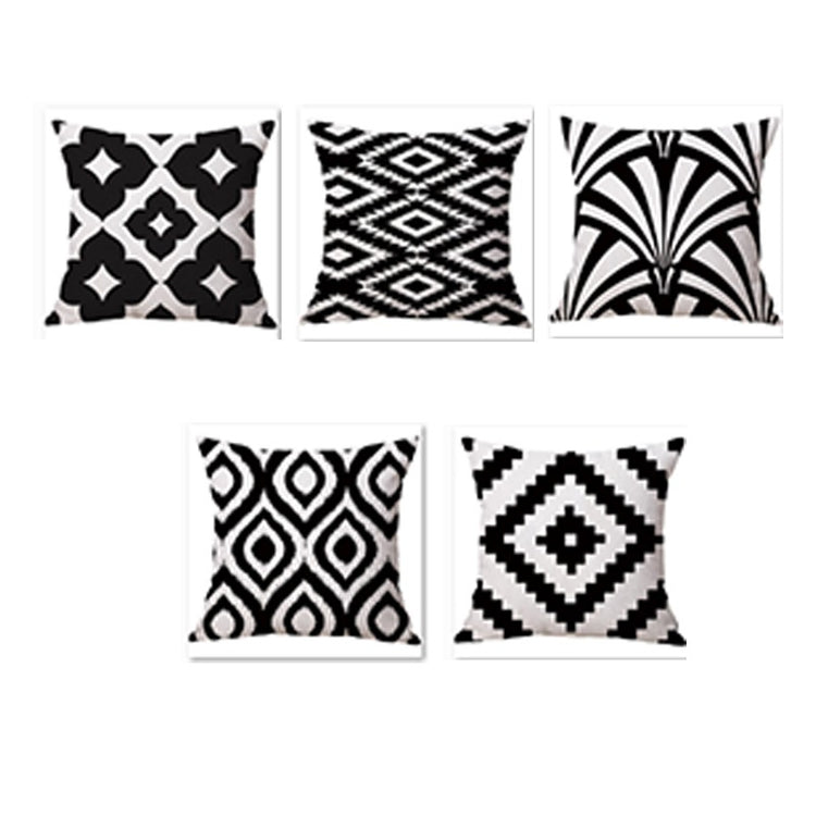 Five black and white cushion covers with diamonds and sweeping leaf-like patterns.